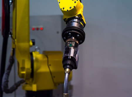 Automatic robotic arm for metal welding operationsの写真素材