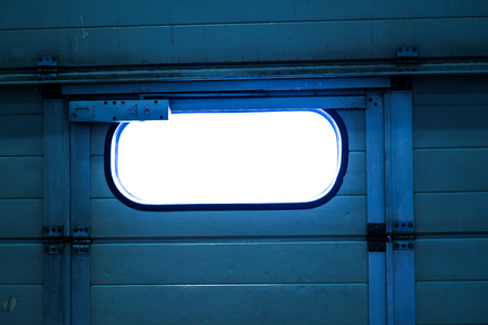 White garage door surrounded by green ivyの写真素材