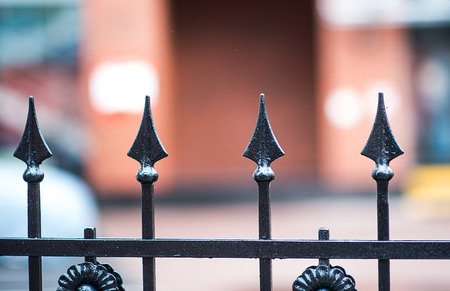 Rusty metal fence with sharp arrows, Used for textured and background, Image has a color effect applied.の写真素材