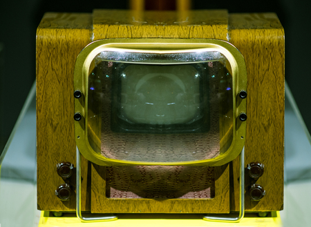Old soviet retro TV on a gray background. The inscription on the white button On. The inscription on the black button Offの写真素材