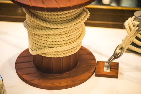 Knecht. A curbstone on the deck of the ship or on the dock to secure the ropes.