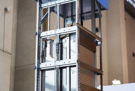 Elevator Installation, Lift Technician Installing a Modern Elevator