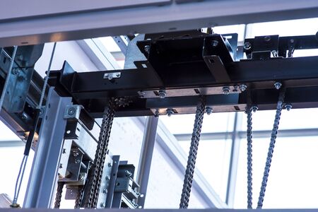 Glass elevator ,Businessman taking modern glass elevator to the upper floors, high building ,office...