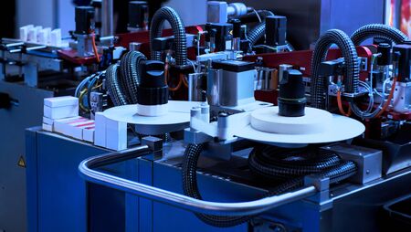 Rotary die cutting machine with slitting blade system.