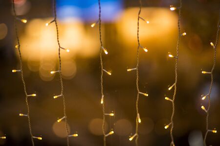 Christmas lights and ornaments. Multicolor bokeh circle background illumination garland decoration ....