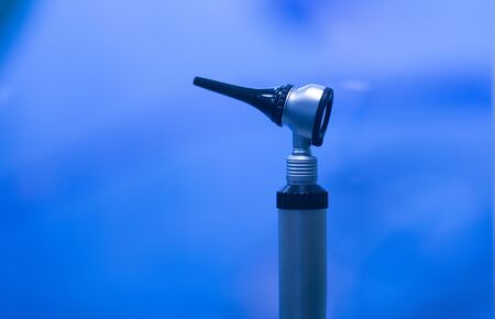Medical Equipment Otoscope for ear on blue background copy space.の写真素材