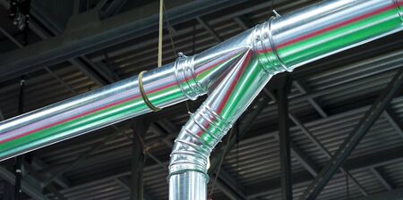 Equipment, cables and piping as found inside of a modern industrial power plant.
