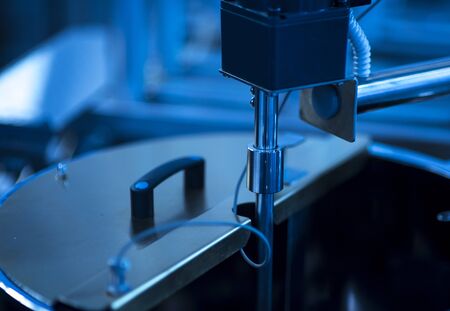 pharmaceutical packing production line conveyer at manufacture pharmacy factory. Authentic shot in challenging conditions. maybe little blurred.の写真素材