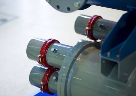 Industrial stainless steel piping connected by special nuts. Cooling system element for the food...