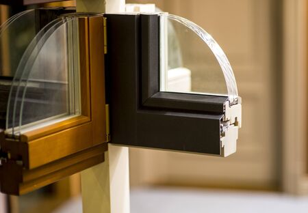 Cutaway model of a plastic and wooden window frame