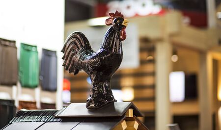 View of metal cock on the little wooden tower roofの写真素材