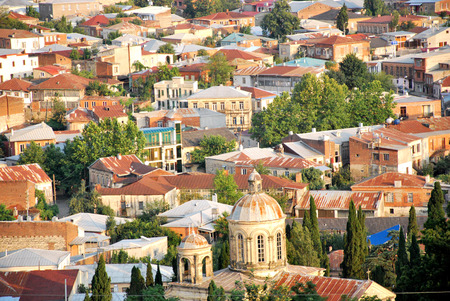 the red roofs of the city, many buildings, old townの写真素材