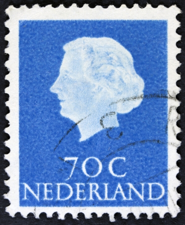 NETHERLANDS - CIRCA 1953  A stamp printed in the Netherlands shows Queen Juliana, circa 1953  Was Queen of Netherlands in the period September 4, 1948 to April 30, 1980  の写真素材