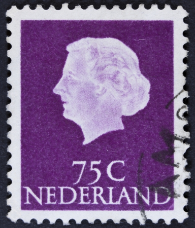 NETHERLANDS - CIRCA 1953  A stamp printed in the Netherlands shows Queen Juliana, circa 1953  Was Queen of Netherlands in the period September 4, 1948 to April 30, 1980  の写真素材