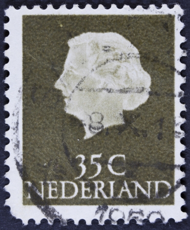 NETHERLANDS - CIRCA 1953  A stamp printed in the Netherlands shows Queen Juliana, circa 1953  Was Queen of Netherlands in the period September 4, 1948 to April 30, 1980  の写真素材