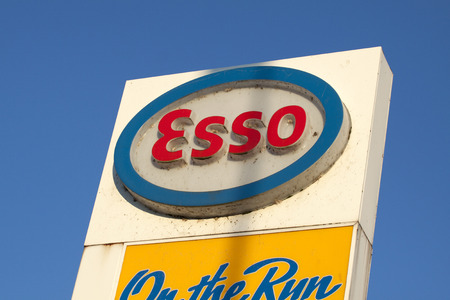 ENKHUIZEN, THE NETHERLANDS - 4 FEBRUARY 2015: white red and blue advertising sign of the esso with a blue sky in the backgroundのeditorial素材