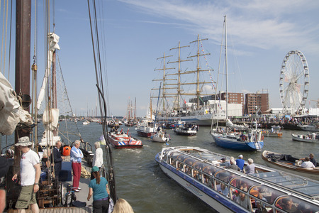 AMSTERDAM, THE NETHERLANDS, 20 AUGUST 2015: People enjoy from the boat of all ships and tall ships falling on the great nautical event SAIL 2015のeditorial素材