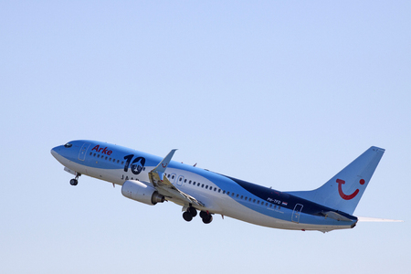 AMSTERDAM, THE NETHERLANDS - SEPTEMBER 30, 2015: Arkefly Boeing 737-800 Has Just taken off from the runway. with the text 10th anniversary of Arke Flyのeditorial素材