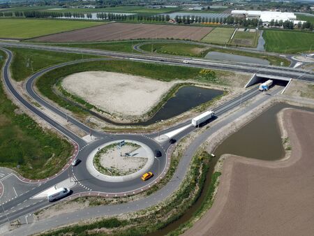 GROOTEBROEK, THE NETHERLANDS - MAY 10, 2019: Drone aerial photo of a traffic circle with on and off roads for the carsのeditorial素材
