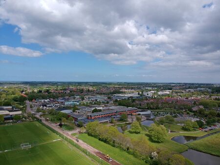 GROOTEBROEK, THE NETHERLANDS - MAY 10, 2019: Drone Aerial view development of an elongated Dutch village on a sunny dayのeditorial素材