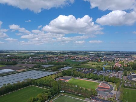 GROOTEBROEK, THE NETHERLANDS - MAY 10, 2019: Drone Aerial view of soccer fields and the buildings of...