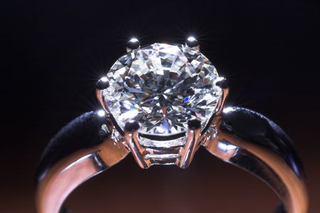 Two carat diamond engagement ring with dark backgroundの写真素材