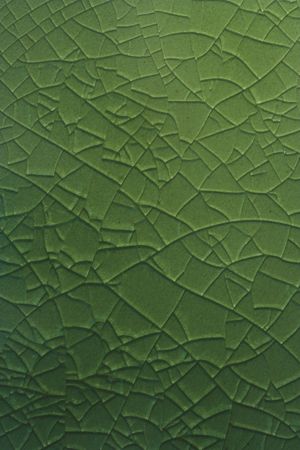 Cracked green glass lined backgroundの写真素材