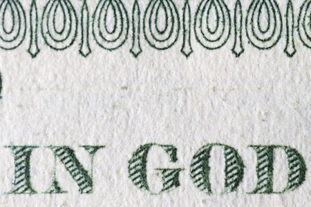 Extreme closeup of the one dollar note In God