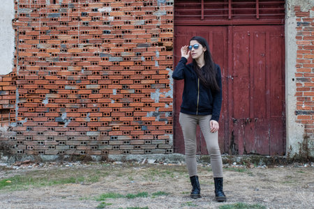 Women closeup outdoors with headphones and sunglassesの写真素材