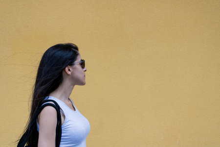 Women closeup outdoors with headphones and sunglassesの写真素材