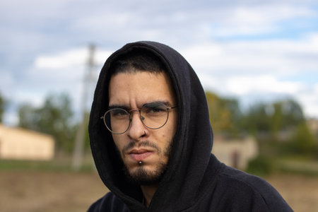 young man from front looking seriouslyの写真素材