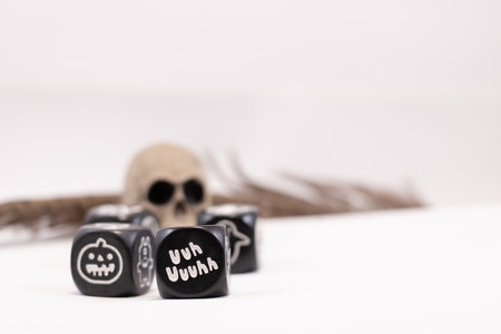 Magic dice with symbols for fantasy games and a skull and featherの写真素材