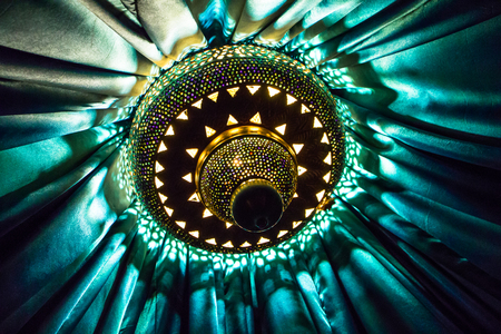 A decorative lamp of mid-eastern style inside a tentの写真素材