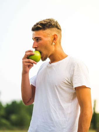 A young attractive sportsman relaxing after training - workout conceptの写真素材