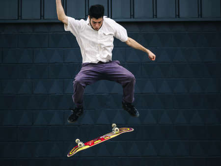 A mesmerizing shot of a young attractive skateboarder doing jump trickの写真素材