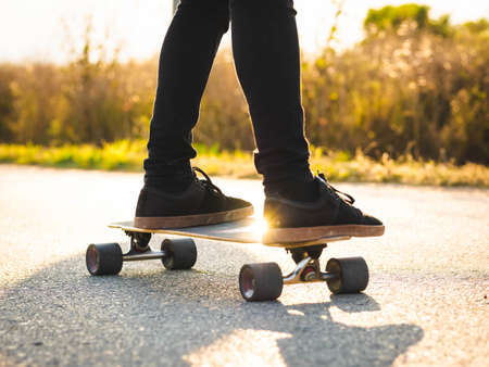 A shallow focus shot of a young male riding a skateboardの写真素材