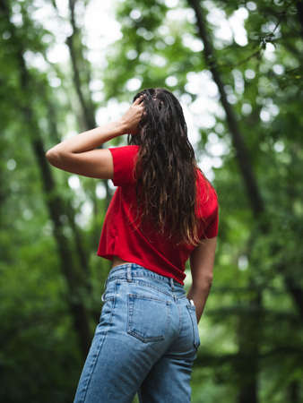 young woman hiker relaxing in the woodsの写真素材