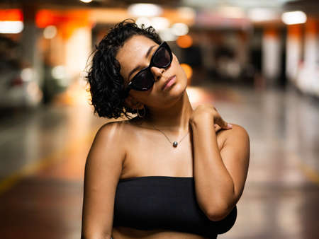 Stylish young female with sunglasses. Stylish female model with vibrant makeupの写真素材