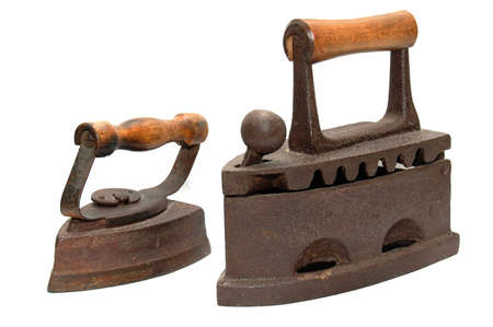 Small and big ancient irons on whiteの写真素材