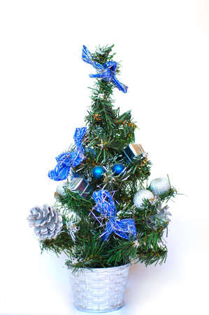 Small artificial Christmas tree in silver flowerpotの写真素材