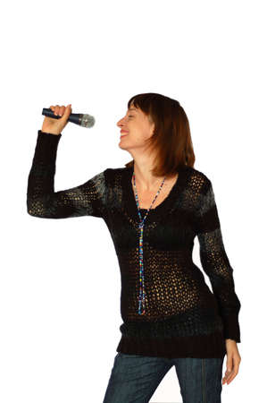 Singing pretty woman with microphone in her handの写真素材