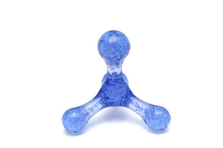 Blue plastic massager with bubbles inside isolated on whiteの写真素材