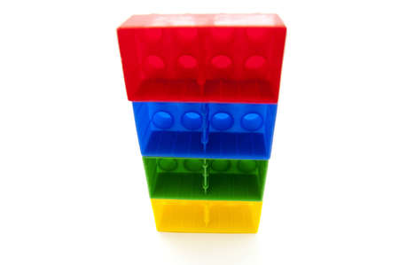 Four plastic blocks from constructor set which are laying one on otherの写真素材