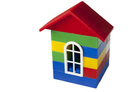 House with red roof made from colorful plastic bricksの写真素材