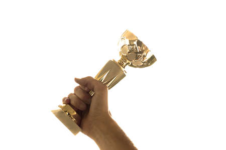 Hanp holding winning cup isolated on white in sepiaの写真素材