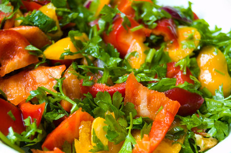 Salad with red and yellow sweet pepper and parsleyの写真素材