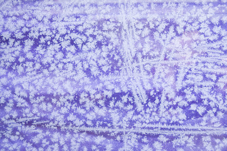 View throuth the frozen window into the violet textileの写真素材