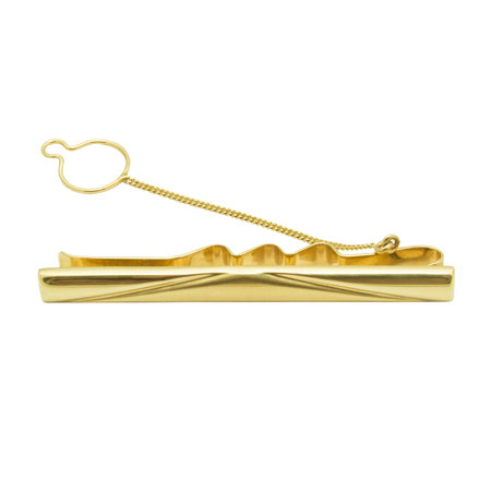 Masculine accessorie - golden clamp for a tie isolated on white backgroundの写真素材