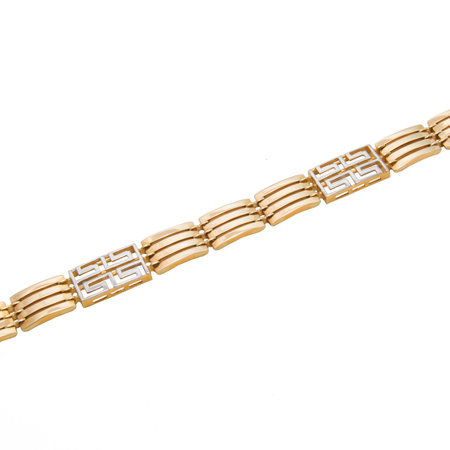 Graceful golden bracelet from yellow and white gold isolated on white backgroundの写真素材