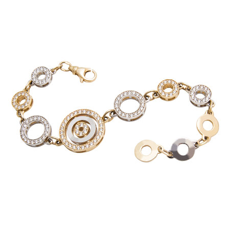 Graceful golden bracelet with diamonds from yellow and white gold isolated on white backgroundの写真素材